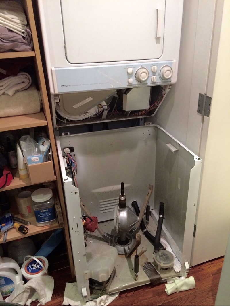AirWatt technician repairing a washing machine